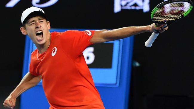 Alex De Minaur celebrates his victory against Swiss surprise packet Henri Laaksonen on Margaret Court Arena last night. Picture: AFP