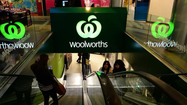 Customers come out from a Woolworths retail shop in Sydney on June 24, 2014. South African retail giant Woolworths on June 24 announced a bid to buy out Australian fashion chain Country Road as part of its plan to takeover prestigious department store David Jones. AFP PHOTO / SAEED KHAN