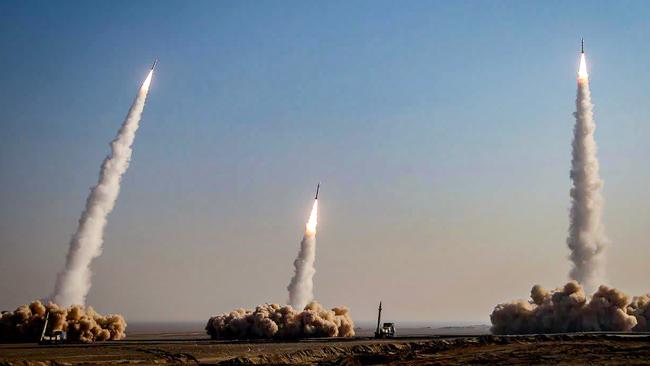 A launch of missiles during a military drill in an unknown location in central Iran - the country is ramping up its capabilities of producing weapons grade uranium.