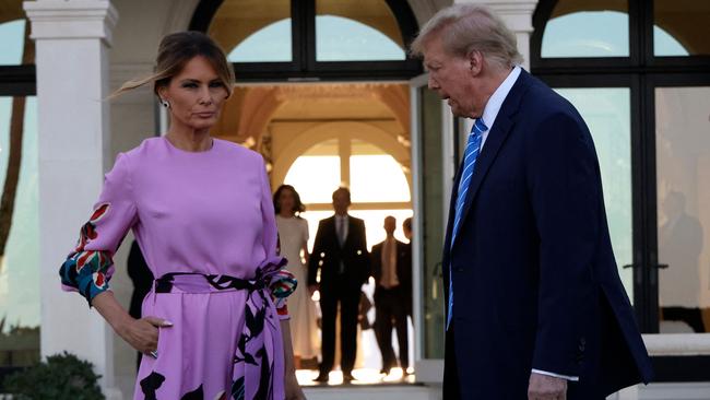 Donald and Melania Trump arrive at the Florida home of billionaire investor John Paulson on Saturday. Picture: Getty Images