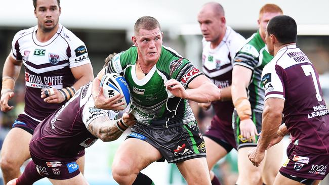 Thomas Gilbert (centre) in action for Townsville Blackhawks. Picture: Zak Simmonds