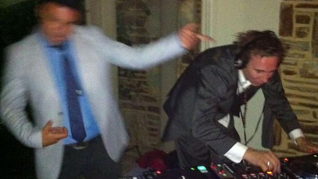 News Corp journalist Mikey Cahill (DJ Joey Lightbulb, right) DJing at a wedding in 2010.