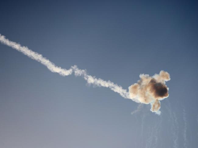 Rockets fired from the Gaza Strip are intercepted by Israel's Iron Dome defence missile system over the southern Israeli city of Sderot. Picture: AFP