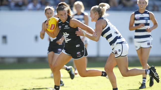 Abbie McKay of Carlton breaks a tackle during the round 4 AFLW match against Geelong Cats in 2019. (Photo by Darrian Traynor/Getty Images)