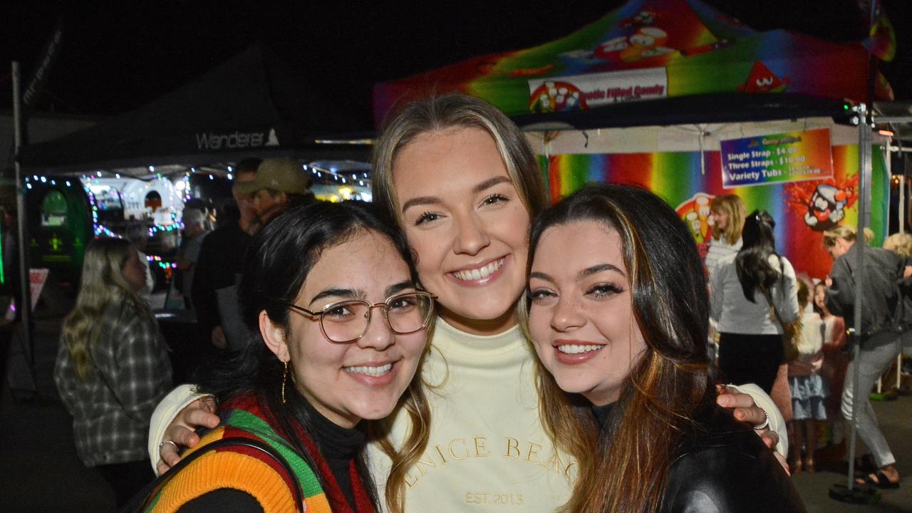 Linda McBride, Lahni Biggens and Georgia Gamble at Night Bite markets at Palm Beach-Currumbin SHS, Palm Beach. Pic: Regina King