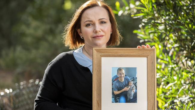 Jessica Maris holds a picture of her late husband Brian. Picture: Jake Nowakowski