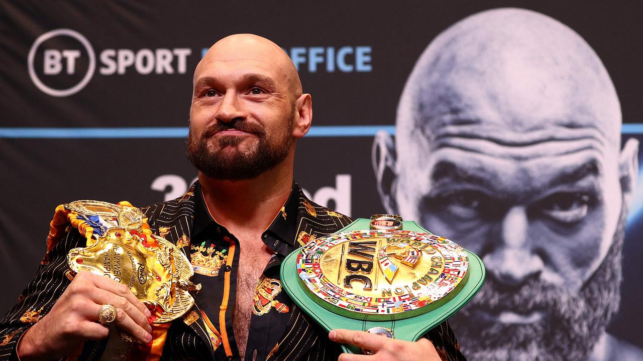 (FILES) In this file photo taken on April 20, 2022 World Boxing Council (WBC) heavyweight titleholder Britain's Tyson Fury takes part in an pre-fight press conference at Wembley Stadium in west London