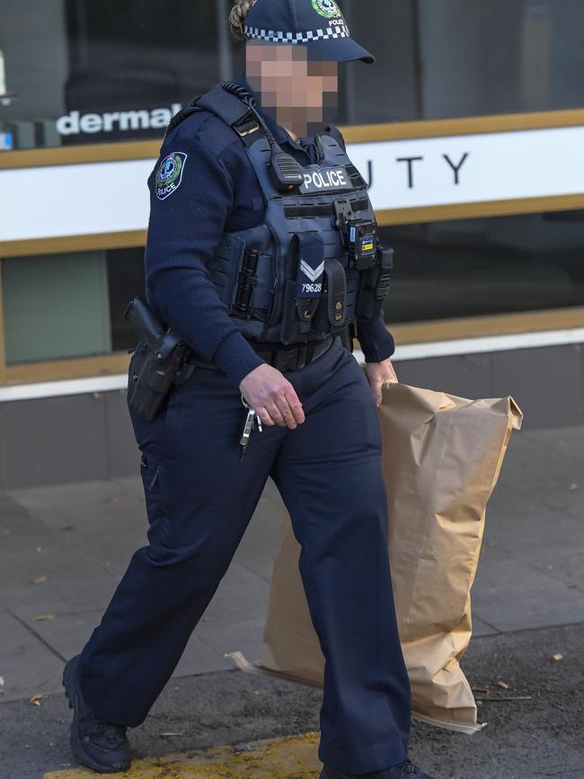 Police at the scene at Minicozzi shopping centre Payneham road. Picture: Roy VanDerVegt
