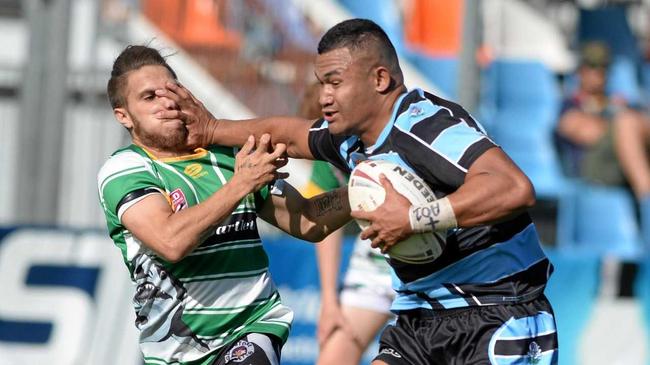 CHARGING RUN: Norths fullback Phil Futi fends off a Fitzroy/Gracemere opponent during his team's big win at Browne Park on Sunday afternoon. Picture: Allan Reinikka ROK310319aleague5