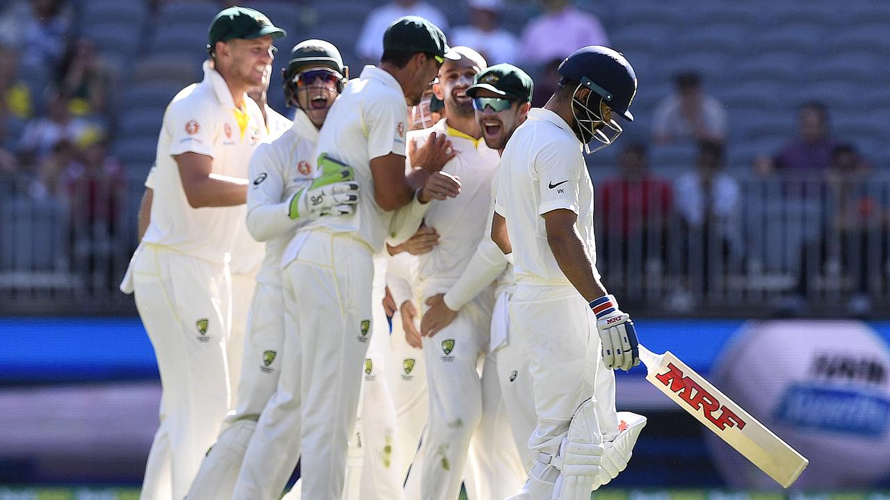 Indian captain Virat Kohli departs after being dismissed by Nathan Lyon.