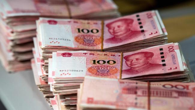 Bundles of 100 yuan notes at a bank in Shanghai. Picture: AFP