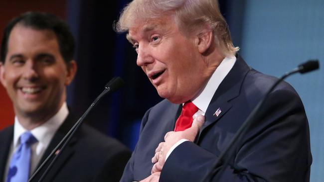 CLEVELAND, OH - AUGUST 06: Republican presidential candidates Donald Trump (R) and Wisconsin Gov. Scott Walker participate in the first prime-time presidential debate hosted by FOX News and Facebook at the Quicken Loans Arena August 6, 2015 in Cleveland, Ohio. The top-ten GOP candidates were selected to participate in the debate based on their rank in an average of the five most recent national political polls. Chip Somodevilla/Getty Images/AFP == FOR NEWSPAPERS, INTERNET, TELCOS & TELEVISION USE ONLY ==