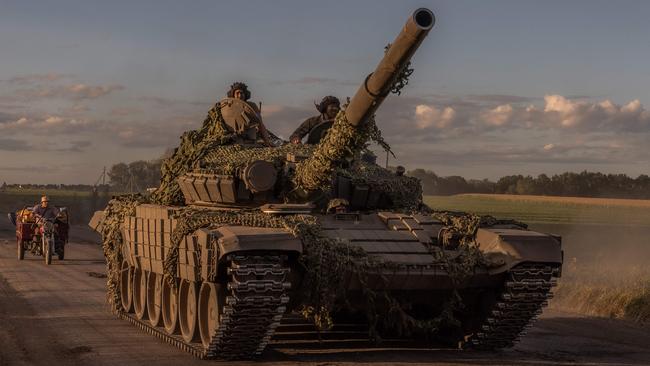 Ukrainian servicemen operate a Soviet-made T-72 tank in the Sumy region, near the border with Russia, this week. Picture: AFP