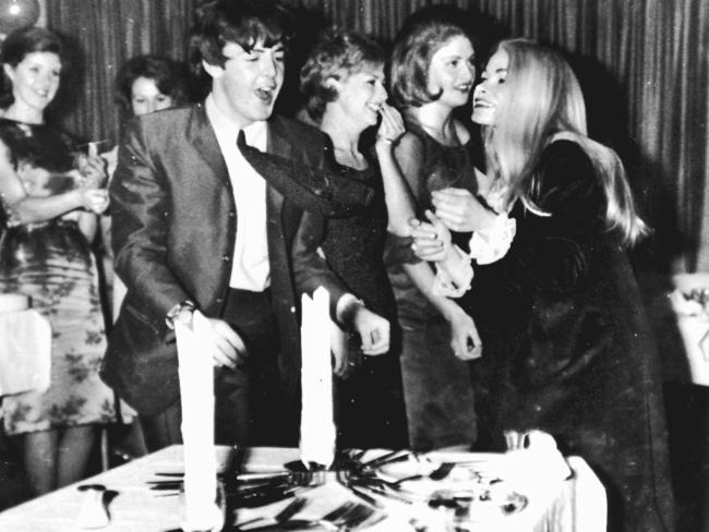 Paul McCartney member of band “The Beatles” celebrates his birthday in Sydney with Delphine Morrisey (R) other fans during their Australian tour in 1964. Picture: News Corp