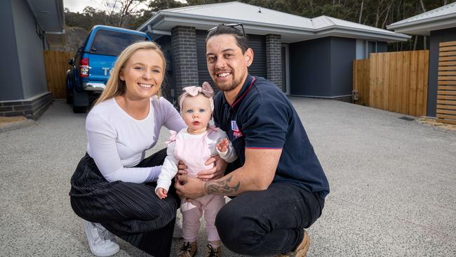 TK Ahipene and partner Laura Donnelly with their daughter Isla at the investment property they recently purchased in the Hobart suburb of Glenorchy. Picture: Peter Mathew