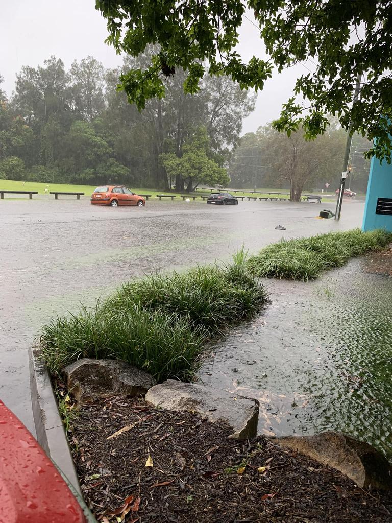 Cars submerged in flood waters in Nuban Street at Currumbin Waters. Photo: Breeza Tolan/Facebook