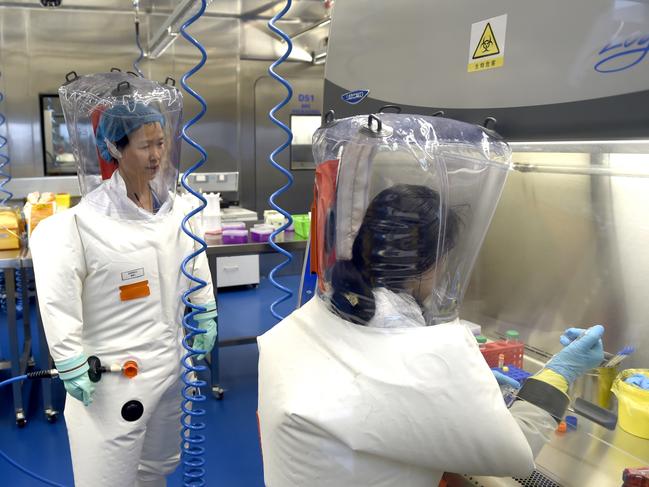 Virologist Shi Zheng-li works with her colleague in the P4 lab of Wuhan Institute of Virology in 2017. Picture: Feature China/Barcroft Media via Getty Images