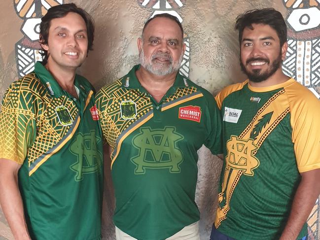 St Mary's vice-president Marius Clarke, Essendon and St Mary's legend Michael Long and Premier League captain Shannon Rioli in front of Lulu Coombes' Tiwi artwork at the renovated Saints clubhouse. Picture: Grey Morris