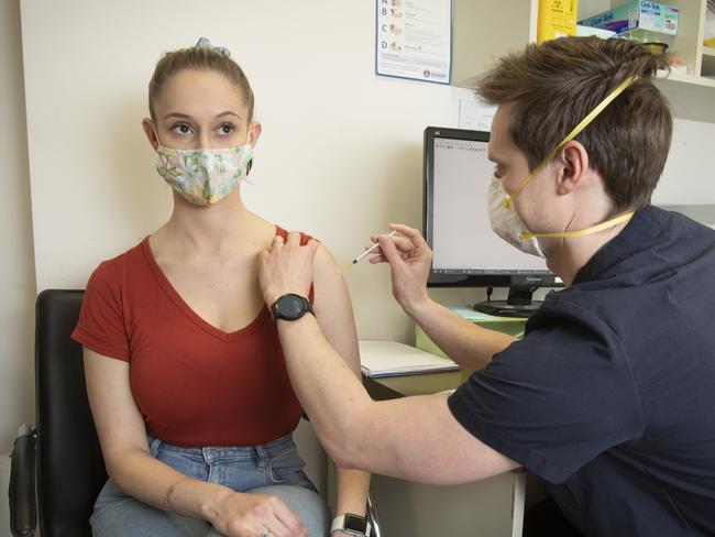 22 year old Chelsea Paton is getting her AstraZeneca vaccine being given by Dr Rob Nelson at Northbridge Medical Practice. Picture Chris Pavlich for The Australian