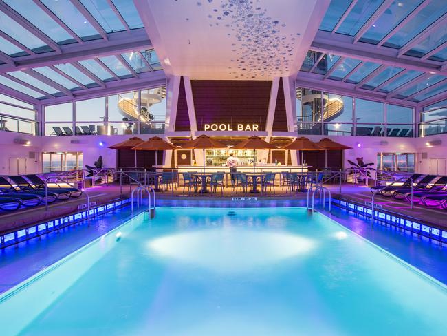 Royal Caribbean introduces its newest and most technologically advanced cruise ship Anthem of the Seas. Pool Bar at sunset