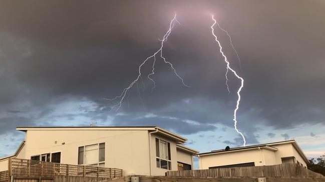 Lightning strikes over a home at Old Beach on Hobart's Eastern Shore. Reader's picture: NICK WOODWARD