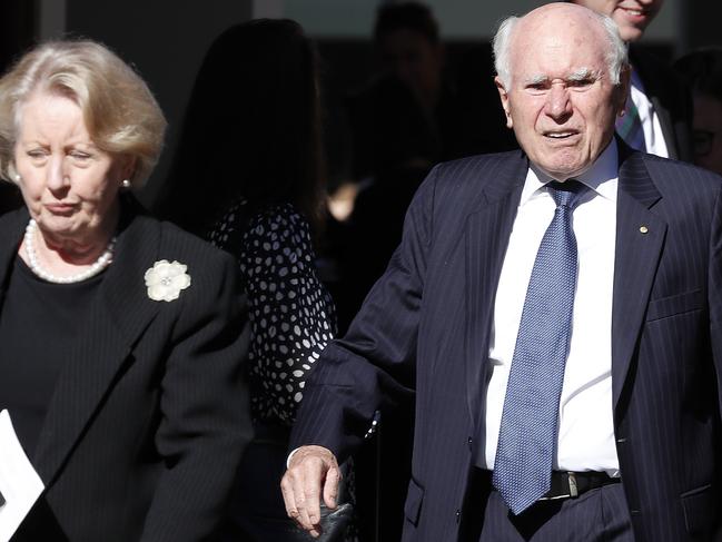 Former Prime Minister John Howard and wife Janette leaving the funeral service for Judy Baird. Picture: Toby Zerna