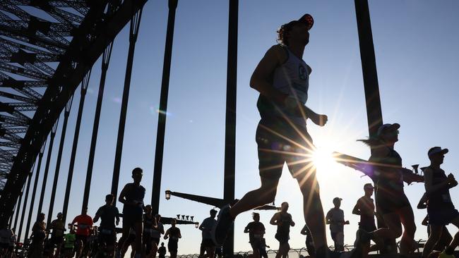 Competitors run across the Sydney Harbour Bridge during the 2023 Sydney Marathon. Picture: Jenny Evans/Getty Images