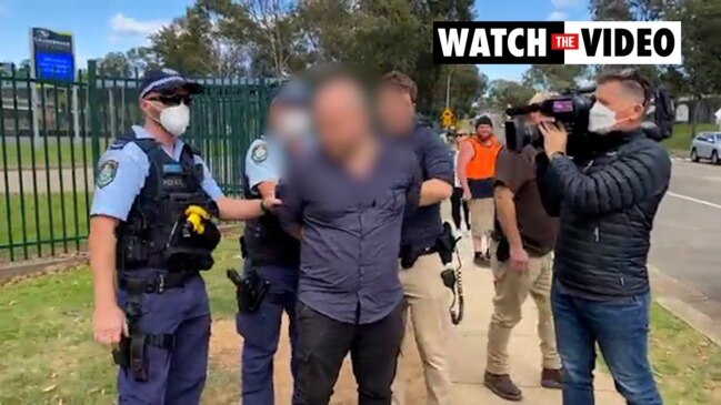 Protester arrested outside high school over COVID-19 vaccinations