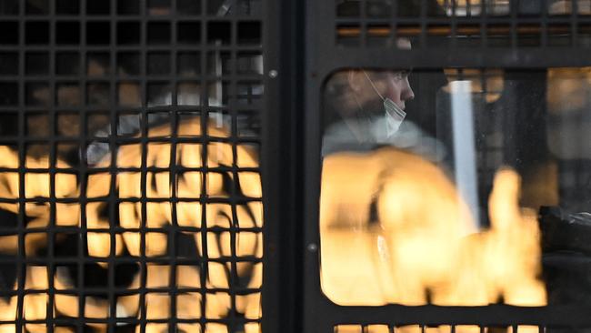 A police officer looks out from inside a police bus parked at Moscow's Pushkinskaya Square ahead of an unsanctioned protest against Russia's invasion of Ukraine. Picture: AFP