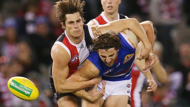 Jack Steele strips the ball off Marcus Bontempelli. Picture: Michael Klein