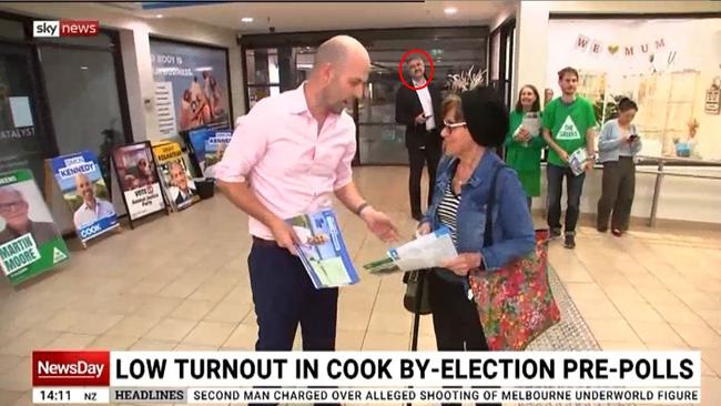 Ian Zakon featured in the background of a television report from pre-polling in the seat of Cook, a sneaky parliamentary pass visible beneath his suit jacket. Picture: Sky News