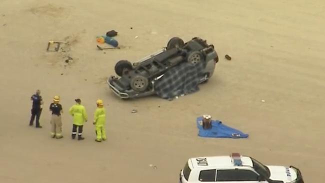 A French tourist has died and four others were hospitalised after a 4WD rollover at Teewah Beach on Sunday afternoon. Photo: Nine News