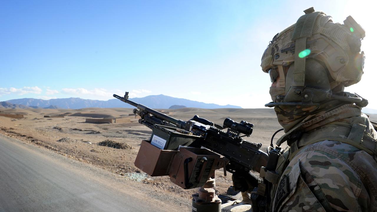 An Australian Army soldier from Special Operations Task Group keeps watch from the back of a Bushmaster during a mounted patrol near Tarin Kowt, Afghanistan. Picture: Department of Defence