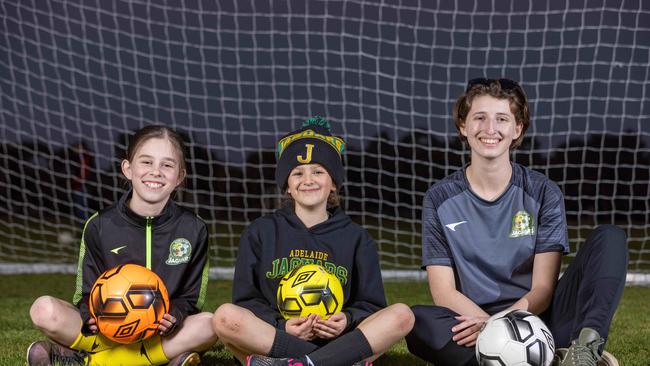 Ruby Webber (U13s), Angelique Juric (U9s) and Lara Hoffman (seniors) of the Adelaide Jaguars Soccer Club. The women’s game is set for a significant spike in participation amid the success of the Matildas. Picture: Ben Clark