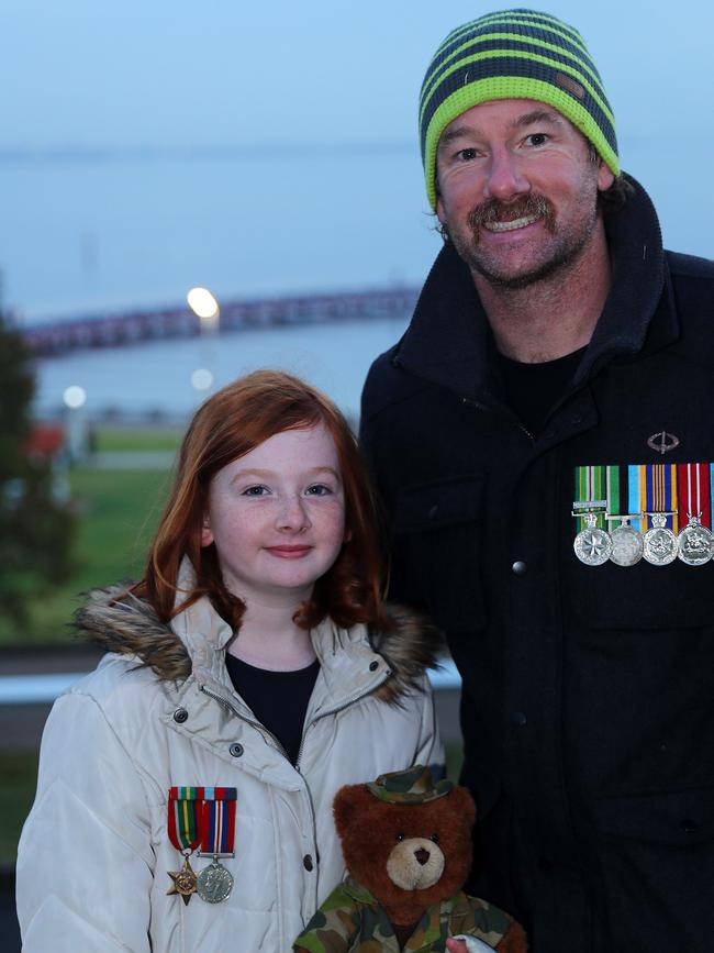 Returned service man Andrew Johnson and daughter Brydie, 9, at Geelong’s dawn service. Picture: Alison Wynd