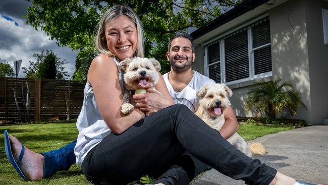 Peter Mangiotis and Gabrielle Ding bought in their suburb only because they needed a yard for dogs Whiskey and Disco. Picture: Jake Nowakowski