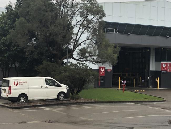 An Australia Post distribution centre has been established on Rodborough Rd, Frenchs Forest, next door to the site where demolition work is almost complete to clear the site of a $48 million, five-storey Bunnings hardware store. Picture: Jim O'Rourke