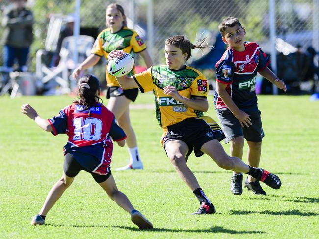 Xavier Piper keeps possession for Gatton State School in the inaugural Primary Interschools Reconciliation Touch Carnival hosted by Glenvale State School, Wednesday, May 28, 2025. Picture: Kevin Farmer