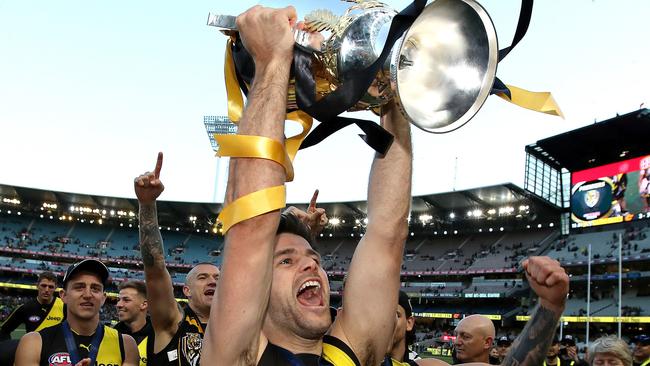 Trent Cotchin holding the 2019 premiership cup aloft. Picture: Phil Hillyard