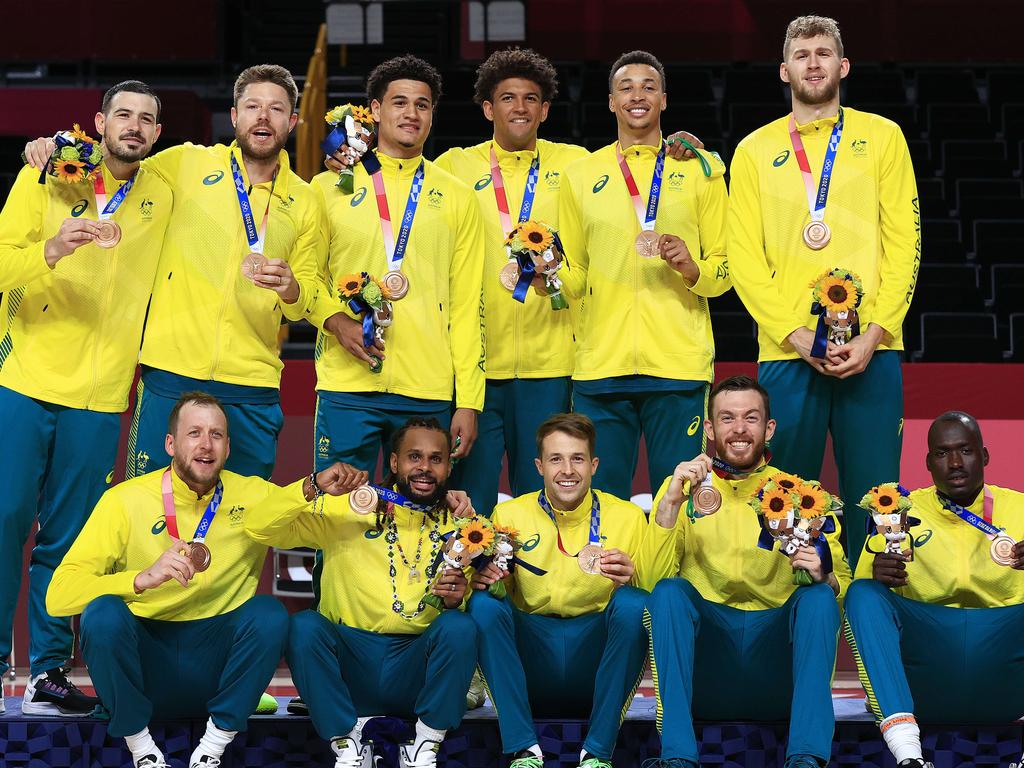 Patty Mills and Australia celebrates winning the Bronze medal at the Tokyo 2020 Olympics. Picture: Adam Head