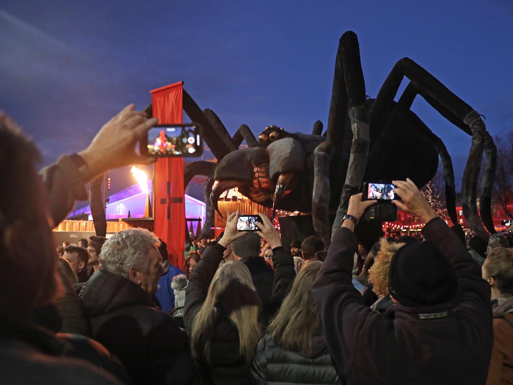 The Tasmanian cave spider-shaped Ogoh-Ogoh is paraded through Morrison St on the way to Dark Park at Macquarie Point. Picture: LUKE BOWDEN