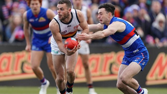 BREAKING AWAY: Crow Brad Crouch breaks clear of Bulldog Toby McLean during this year’s round 23 clash in Ballarat. Picture: SCOTT BARBOUR (AAP)