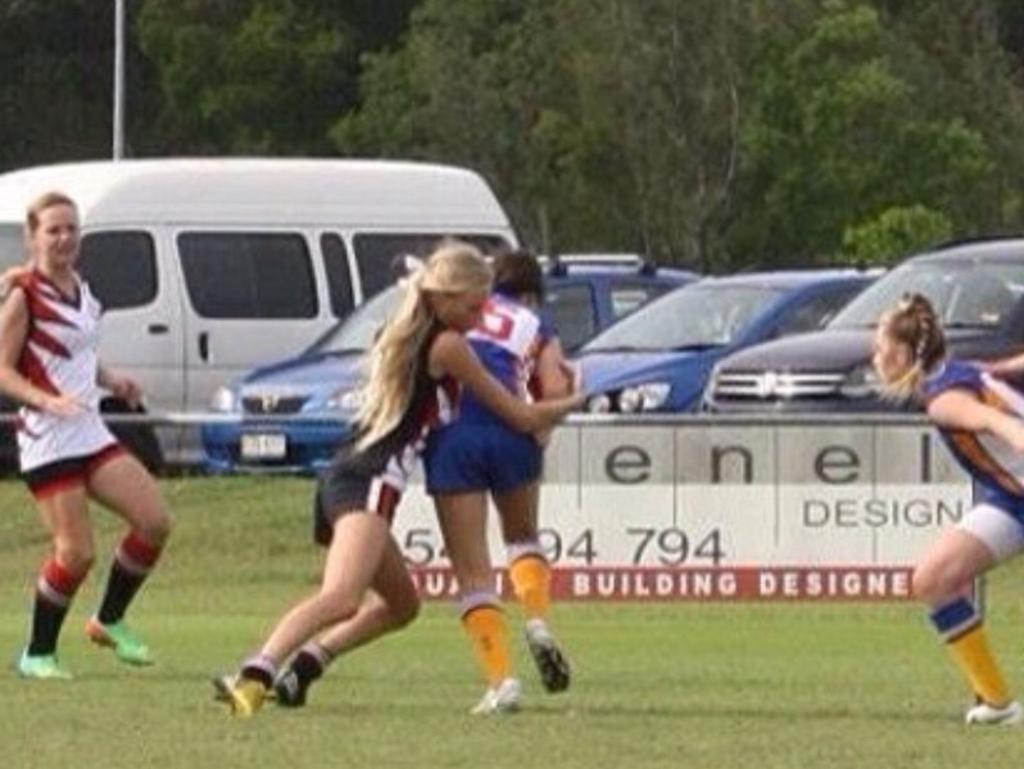 Sarah Marschke makes a tackle playing AFL in Sydney.