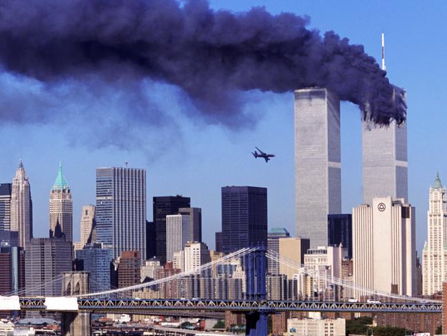 Hijacked United Airlines Flight 175 aircraft about to fly into second tower of World Trade Centre in New York soon after another commercial aircraft had flown into the other tower where smoke still billows. September 11, 2001. World Trade Center.