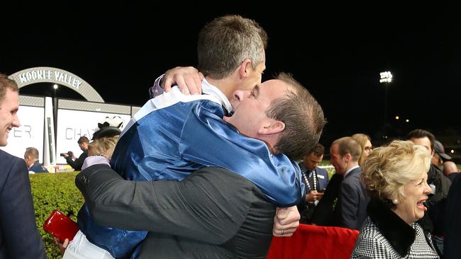 Jockey Joe Bowditch gets a hug by one of the syndicate members after riding Viddora to win in the Moir Stakes. Picture: AAP Image/George Salpigtidis