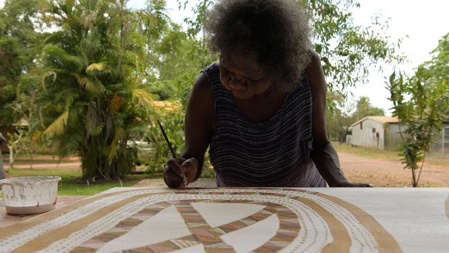 Artist paints at Pirlangimpi Art Centre. Picture: (A)manda Parkinson