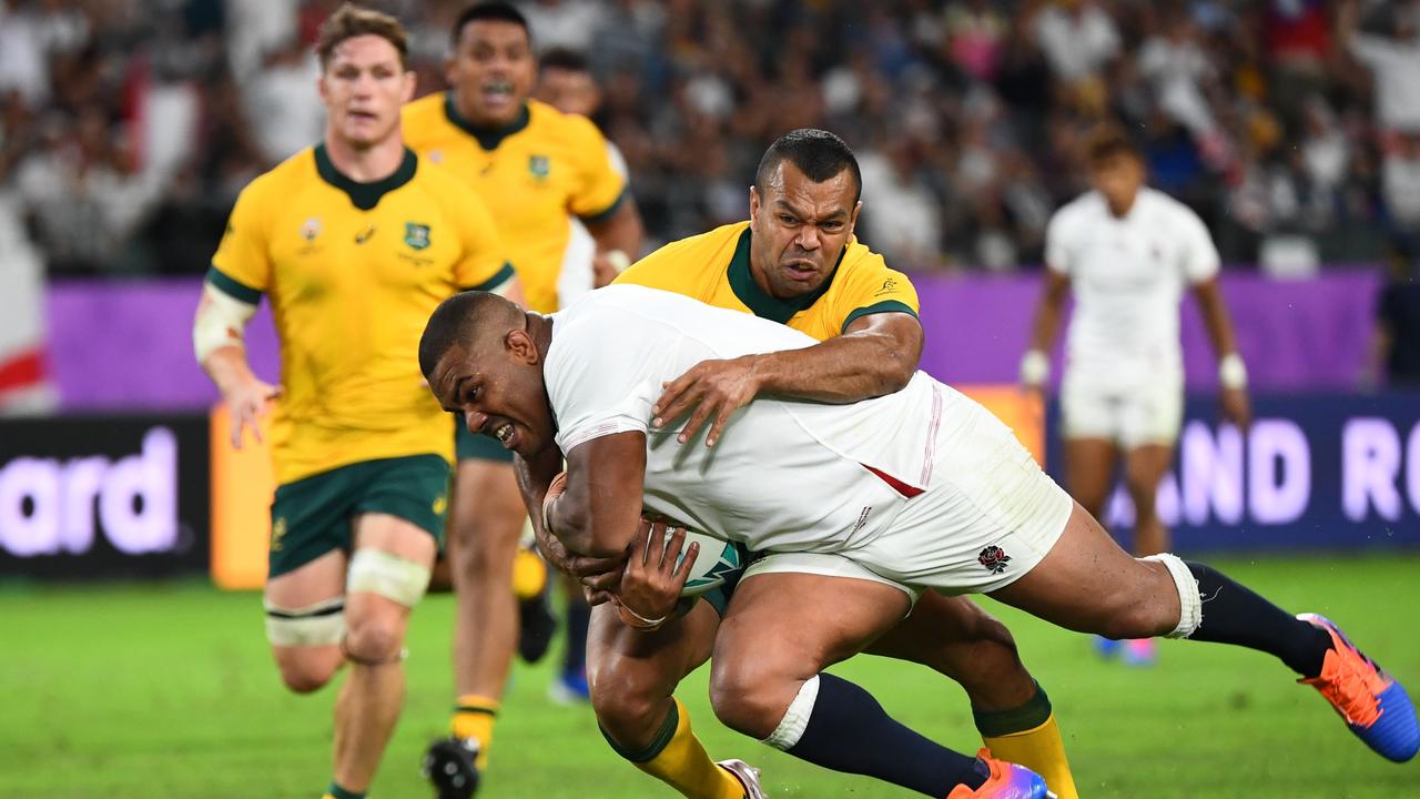 England prop Kyle Sinckler runs past Australia fullback Kurtley Beale to score a try.