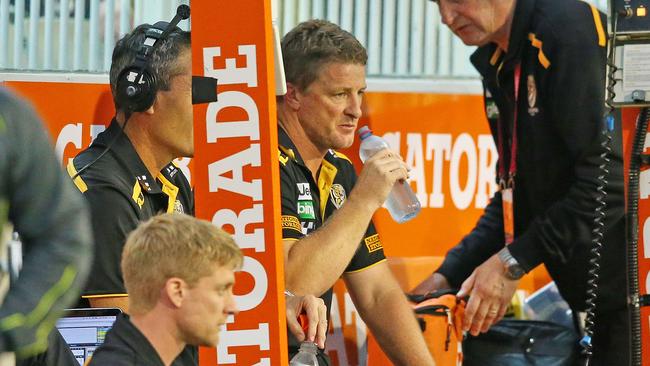 Damien Hardwick sat on the boundary line during the third quarter. Picture: Getty