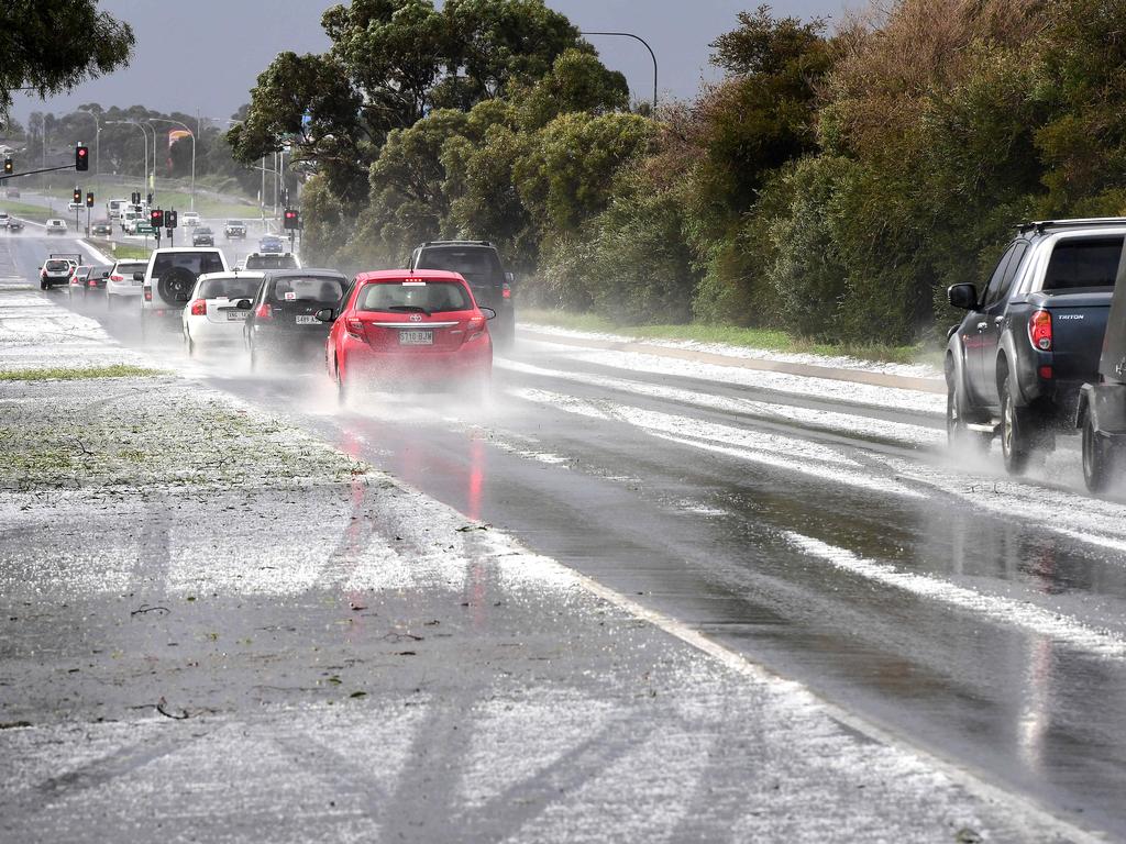 Hail covers the Lonsdale Freeway at Hallett Cove. Picture: Campbell Brodie