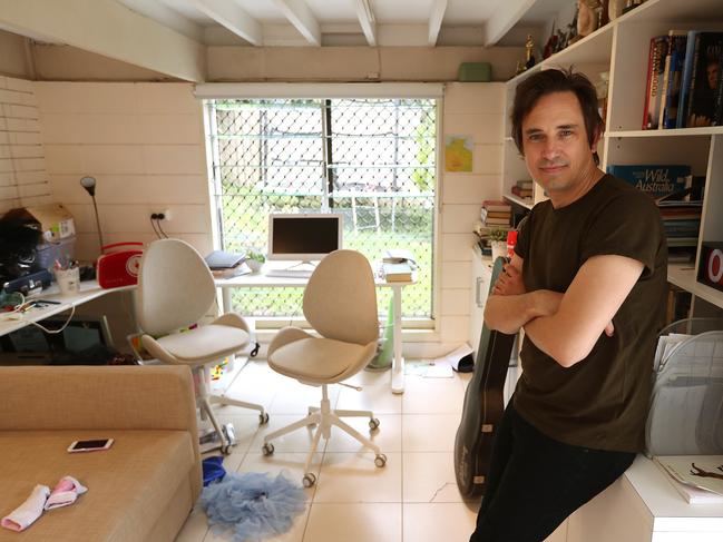 15/4/2019: Author and journalist Trent Dalton in outside his downstairs study, sitting on his Marshall amp. with "Keef" the Stonefish, a childhood gift from his dad, and probably Trents most treasured possession, at his home,  in The Gap, Brisbane. Trent has had a huge publishing success with his first novel "Boy Swallows Universe" loosely based on his childhood. Lyndon Mechielsen/The Australian